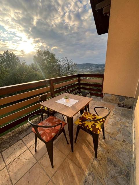 Balcony table and chairs above the valley
