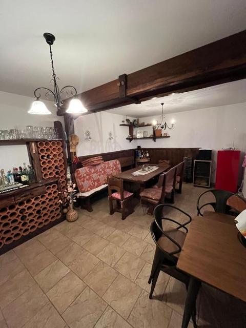 Dining room with a brick wall and chandelier